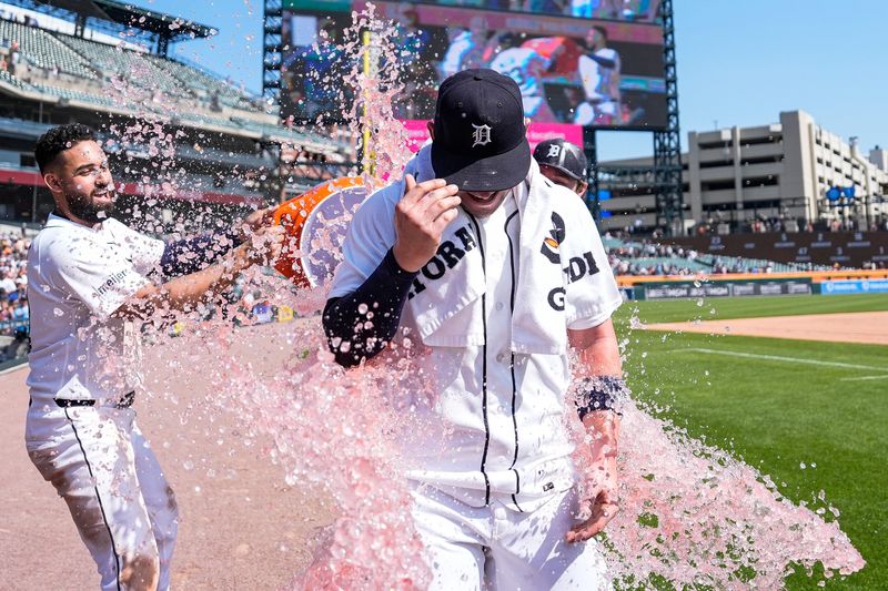 Detroit Tigers left fielder Riley Greene (31) and designated hitter Colt Keith (33) Gatorade bath on first baseman Spencer Torkelson (20) to celebrate Torkelson’s walk-off home run against Milwaukee Brewers at Comerica Park in Detroit on Thursday, April 23, 2026.