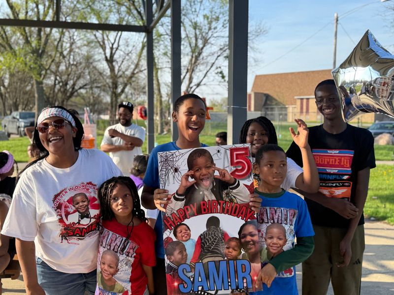Jasmine Grubbs surrounded by her surviving children at a birthday party for her son Samir Grubbs on April 23, 2026, what would have been his 5th birthday, at Skinner Playfield. Samir was gunned down at the park and killed on June 27, 2025.