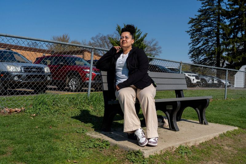 Andreya Chapman, 34, program administrator for the Early Impressions Vandercook Lake program, sits on a bench while watching over a class at Townsend Elementary School in Jackson, on Tuesday, April 21, 2026.
