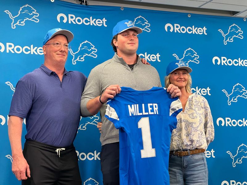 Blake Miller, an offensive tackle from Clemson selected by the Lions in the first round of the 2026 NFL Draft, stands with his parents, Chris and Karen, on Friday at the Lions training facility in Allen Park.