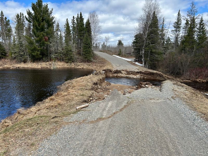 Deer Lake Road at Camp Creek is shown washed out in Michigan's Iron County in the Upper Peninsula amid April 2026 flooding.