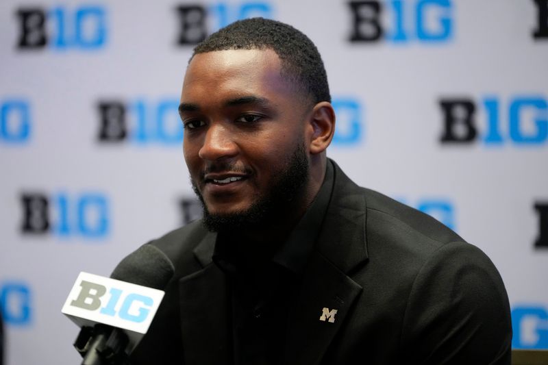 Jul 24, 2025; Las Vegas, NV, USA; Michigan defensive end Derrick Moore speaks to the media during the Big Ten NCAA college football media days at Mandalay Bay Resort. Mandatory Credit: Lucas Peltier-Imagn Images