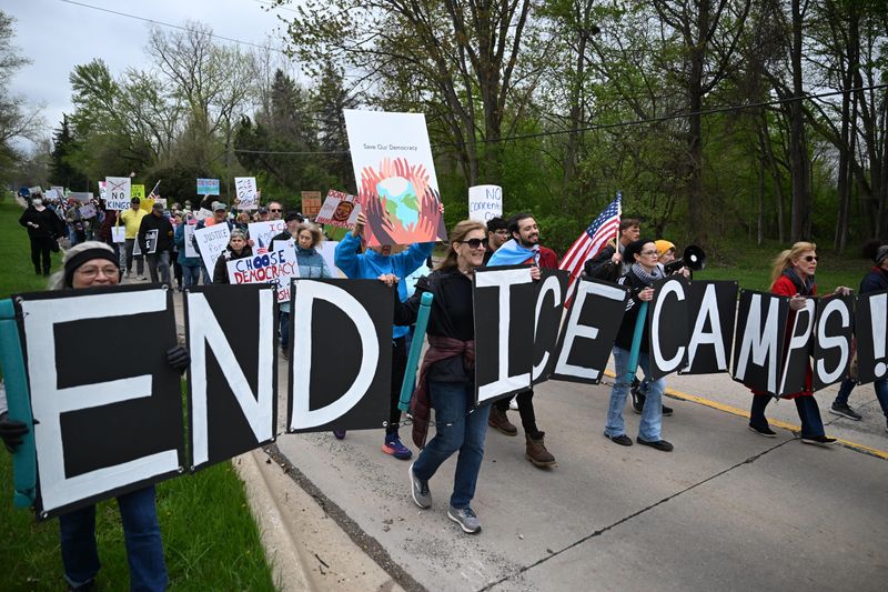 Hundreds of people march in protest toward a proposed ICE facility in Romulus on Saturday, April 25, 2026.