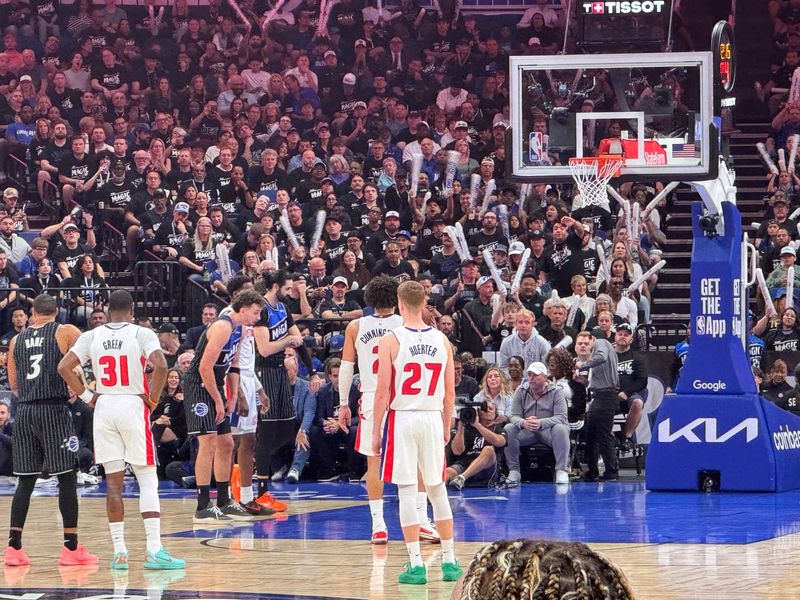 Detroit Pistons Javonte Green and Kevin Huerter wait during the third quarter of their NBA playoff game against the Orlando Magic at the Kia Center in Orlando, Florida, on Saturday, April 25, 2026.