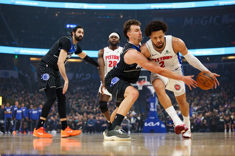Magic forward Franz Wagner (22) guards Pistons guard Cade Cunningham (2) in the first quarter during Game 3 of their Eastern Conference first-round playoff series Saturday, April 25, 2026, in Orlando, Florida.