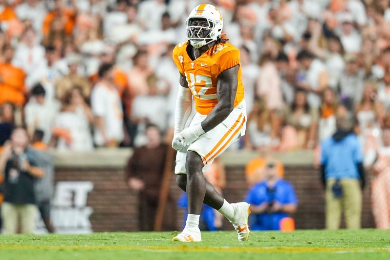 Tennessee defensive lineman Tyre West (42) yells in celebration after a play during a NCAA football game between Tennessee and Florida in Neyland Stadium, in Knoxville, Tenn., Oct. 12, 2024.