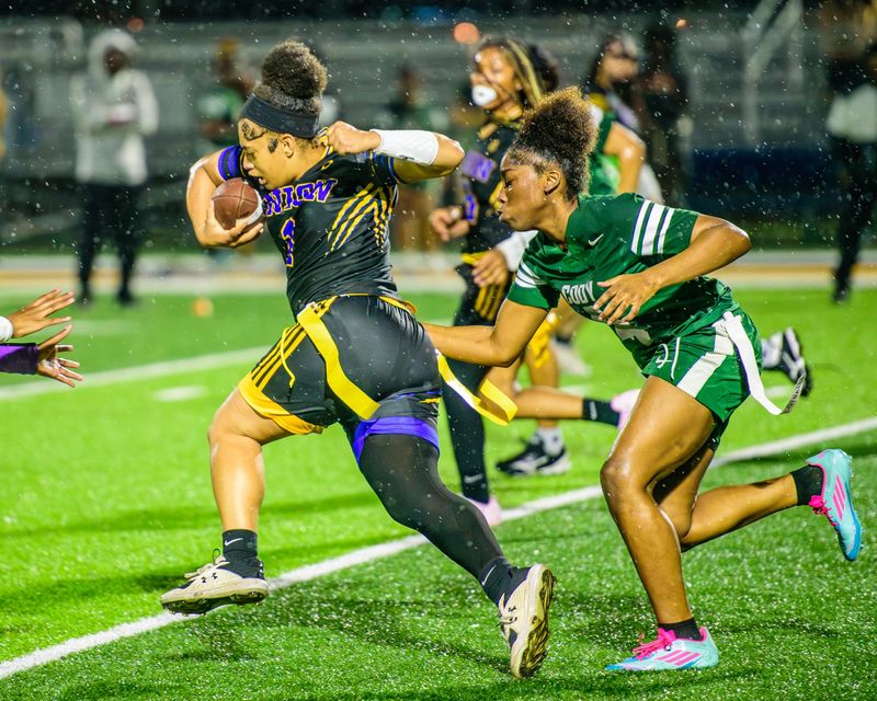 Redford Union's Ameerah Saba rushes during a Michigan Girls High School Flag Football League game on Friday, April 24, 2026, at Bob Atkins Field.