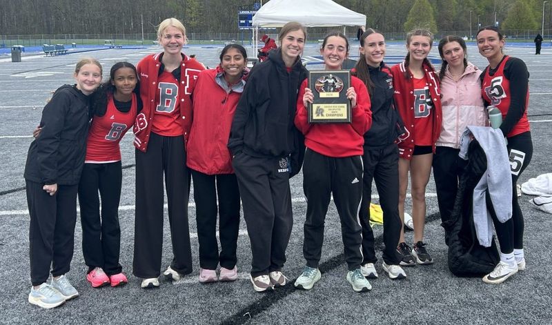 Bedford's girls track and field team celebrates after winning the Lincoln Railsplitters Invitational on Saturday, April 25, 2026.