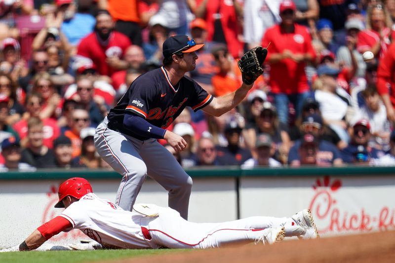Reds outfielder TJ Friedl (29) slides into third base in the third inning against the Tigers on Sunday at Great American Ball Park in downtown Cincinnati.