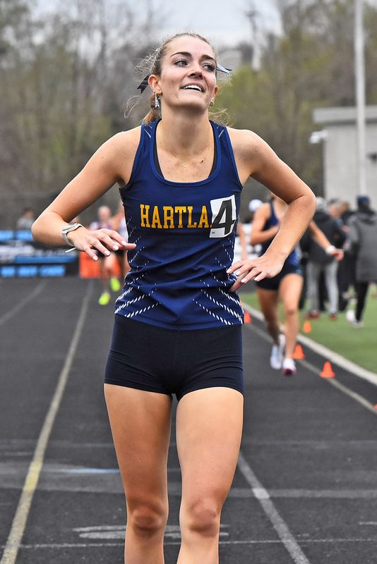 Hartland's Elliana Neuer reacts after running a school-record 2:14.99 in the 800-meter run during the Brighton Bulldog Invitational on Saturday, April 25, 2026.