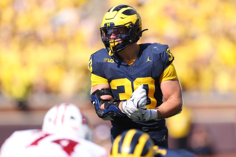 ANN ARBOR, MICHIGAN - OCTOBER 04: Jimmy Rolder #30 of the Michigan Wolverines plays against the Wisconsin Badgers at Michigan Stadium on October 4, 2025, in Ann Arbor, Michigan. (Photo by Gregory Shamus/Getty Images)