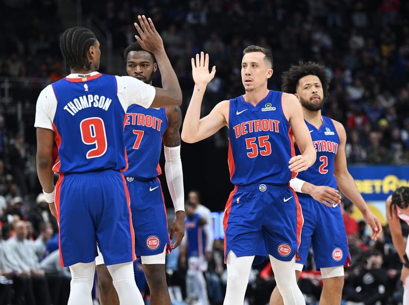Detroit Pistons forward Duncan Robinson (55) celebrates with Detroit Pistons guard/forward Ausar Thompson (9) after a basket in the first quarter. Detroit Pistons vs New York Knicks at Little Caesars Arena on January 5, 2026, in Detroit, MI.