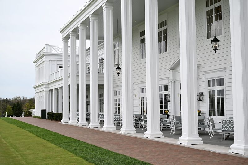 Ten pillars across the front of the veranda with white wood siding at the new Clubhouse on April 27, 2026 at Oakland Hills Country Club in Bloomfield Hills, Mich.