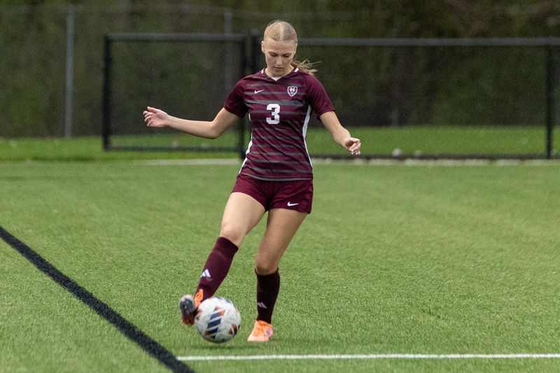 Holland Christian's Cora Boerman passes the ball to a teammate on Monday, April 27.