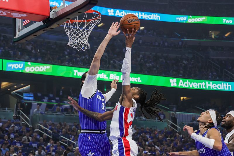 Orlando Magic center Goga Bitadze (35) blocks a shot by Detroit Pistons guard Daniss Jenkins (24) during the second quarter during Game 4 of the first round of the 2026 NBA playoffs at Kia Center in Orlando, Florida, on Monday, April 27, 2026.