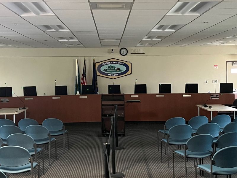 An empty Lyon Township Board meeting room. An anti-data center group is seeking to fill these seats with new officials this fall after getting recall petition language approved against all seven current board members.