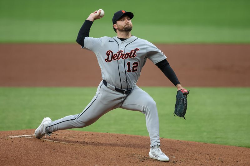 Tigers starting pitcher Casey Mize (12) throws a pitch against the Braves in the first inning at Truist Park.