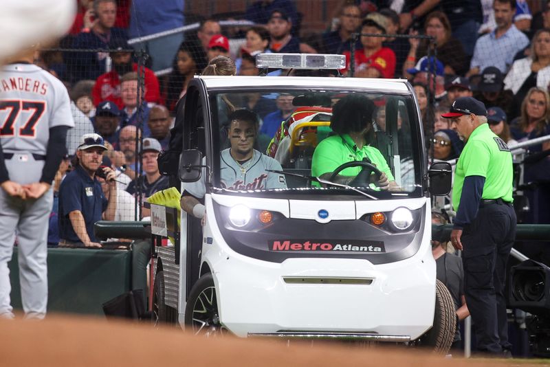 Apr 28, 2026; Atlanta, Georgia, USA; Detroit Tigers center fielder Javier Baez (28) is carted off after an injury against the Atlanta Braves in the fifth inning at Truist Park. Mandatory Credit: Brett Davis-Imagn Images