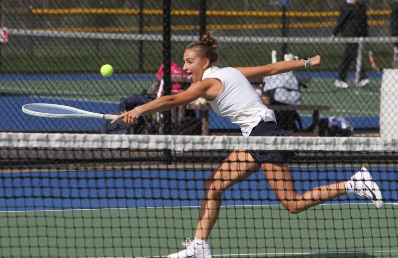 Hartland's Arianna Kinney reaches to make a shot at No. 1 singles during a tennis match against Brighton on Tuesday, April 28, 2026.