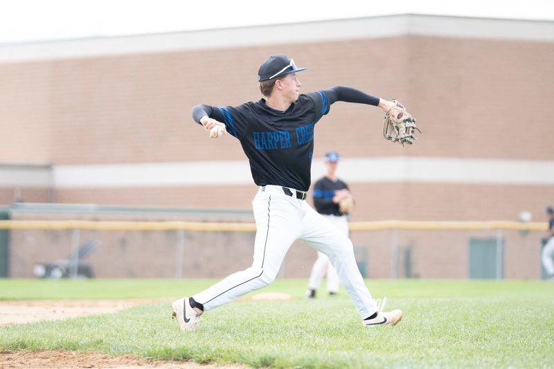 Harper Creek's Maddox McCarty throws the ball during a game at Pennfield High School on Tuesday, April 28, 2026.