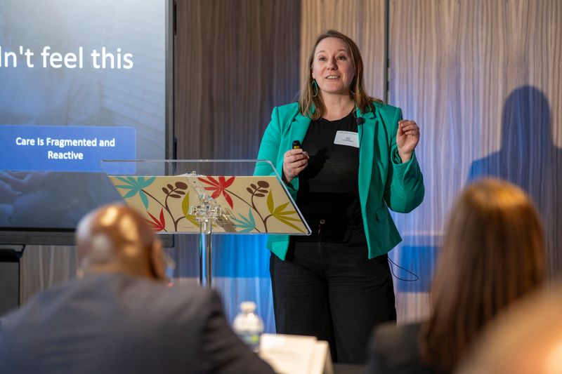 Emily Stone, founder of Whole Mama Michigan, a maternal wellness hub dedicated to supporting mothers through every stage of motherhood, pitches her business at the Lake Trust Entrepreneur Pitch Competition. She won top prize at the event, a $5,000 grant.