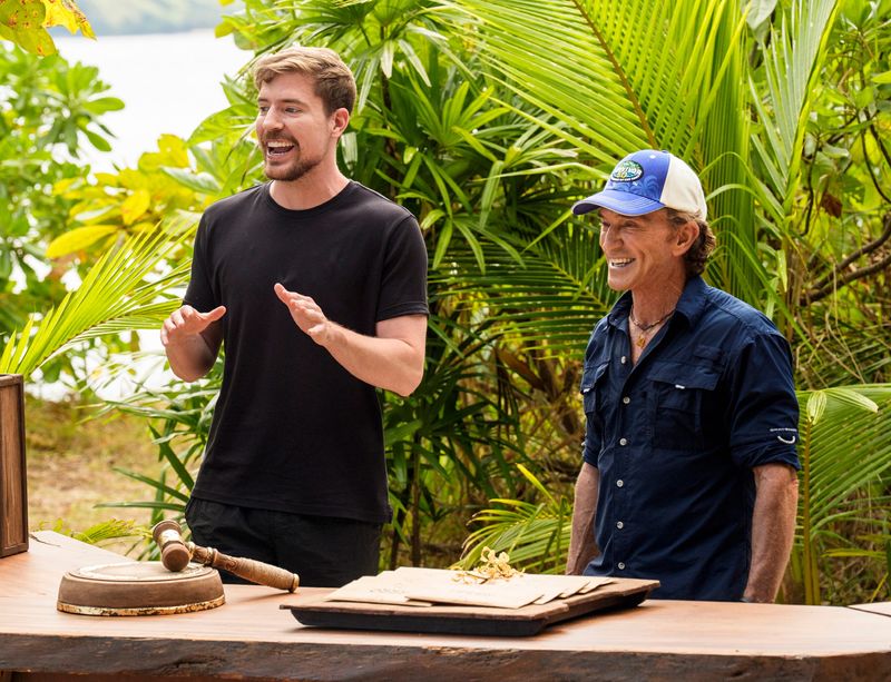 “A Side Dish of Chaos" — One castaway comes clean to the tribe about a previously deceptive move. The crowd favorite Survivor auction returns, with an extra special season 50 spin. Chaos ensues when social media icon MrBeast arrives on the scene, on Survivor 50, Wednesday, April 29, from 8 p.m. to 10 p.m. ET. Pictured L to R: MrBeast and Jeff Probst