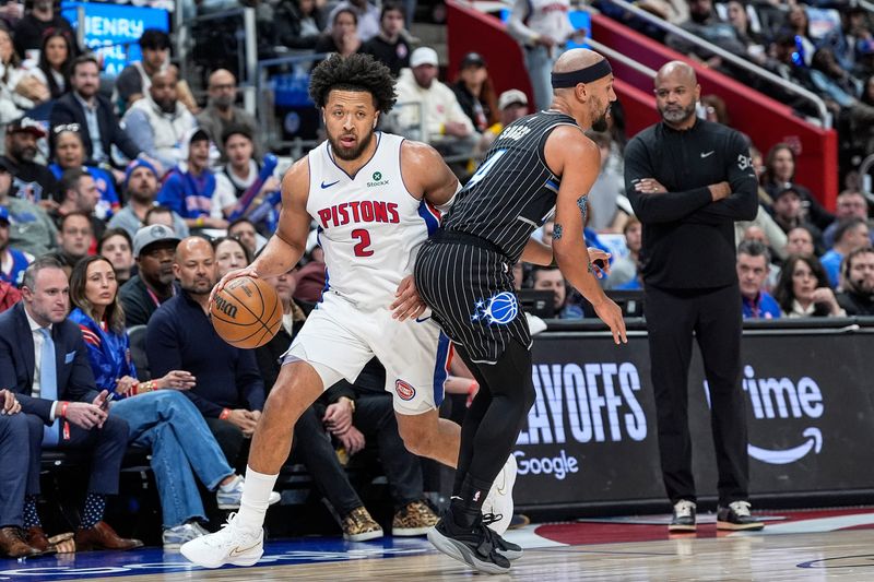 Detroit Pistons guard Cade Cunningham (2) dribbles against Orlando Magic guard Jalen Suggs (4) during the first half of Game 5 of First Round of NBA playoffs at Little Caesars Arena in Detroit on Wednesday, April 29, 2026.