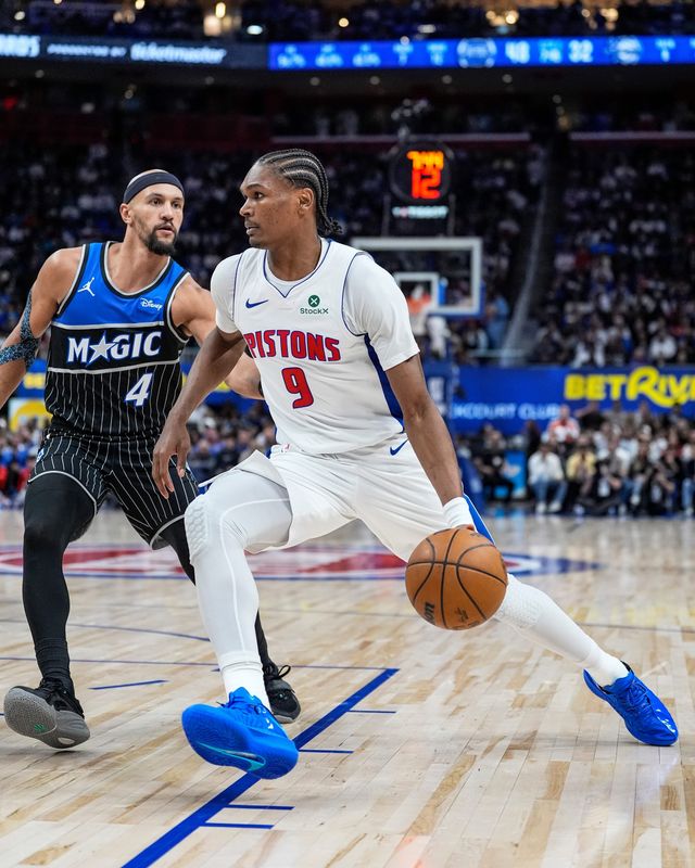 Detroit Pistons guard Ausar Thompson (9) dribbles against Orlando Magic guard Jalen Suggs (4) during the first half of Game 5 of First Round of NBA playoffs at Little Caesars Arena in Detroit on Wednesday, April 29, 2026.