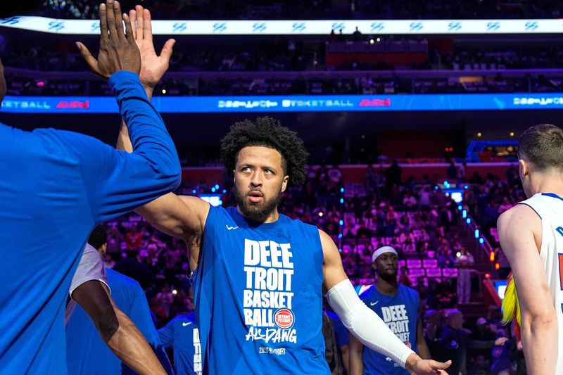 Detroit Pistons guard Cade Cunningham (2) high-fives teammates at players introduction before Game 5 of first round of NBA playoffs at Little Caesars Arena in Detroit on Wednesday, April 29, 2026.