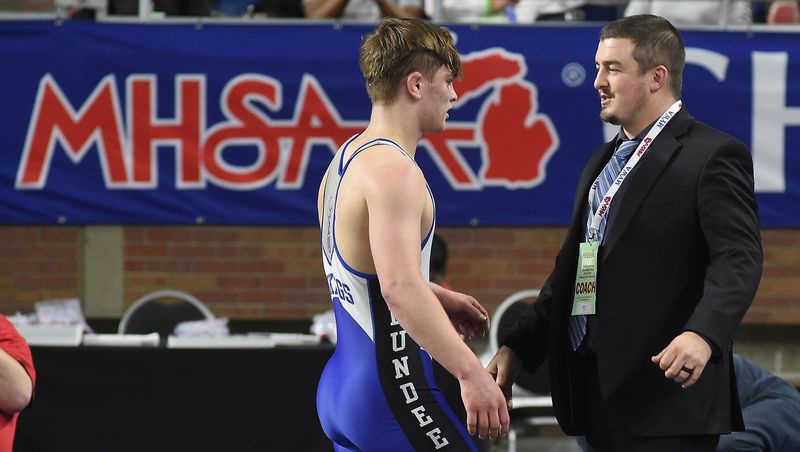 Dundee wrestling coach Garrett Stevens greets Kole Katschor after winning at state championship in 2025. Stevens has been named Monroe County Region Wrestling Coach of the Year.