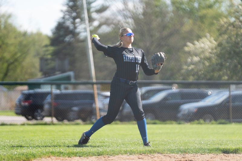 Harper Creek's Kennedy Halverson throws the ball during a game at Pennfield High School on Thursday, April 28, 2026.