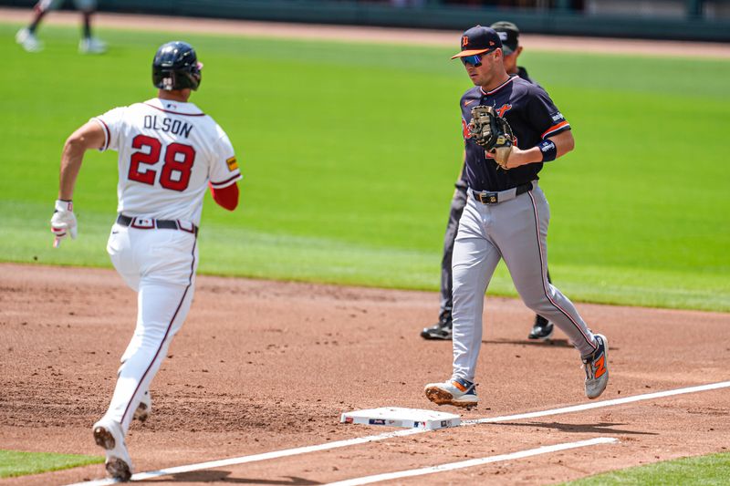 Detroit Tigers first baseman Spencer Torkelson (20) retires Atlanta Braves first baseman Matt Olson (28) after fielding a ground ball during the first inning at Truist Park.