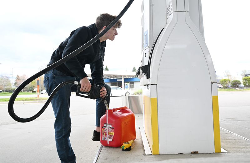 Matthew Middleton, 21, of Goat Mowing in Oxford fills up a gas container for his mower on April 30, 2026 at the Shell gas station in Oxford, Mich.