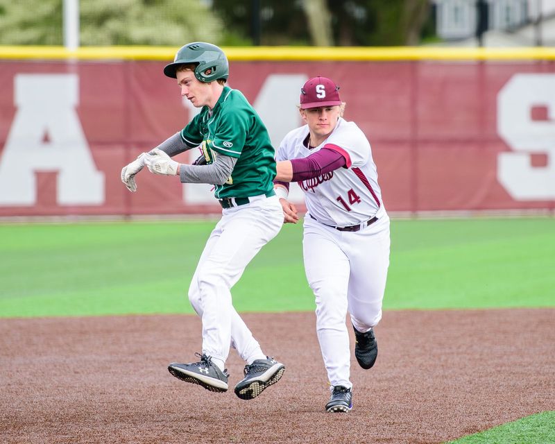 Birmingham Seaholm's Ian Evert tags Birmingham Groves' Robert Morgan during an Oakland Activities Association-Blue baseball game on Thursday, April 30, 2026.