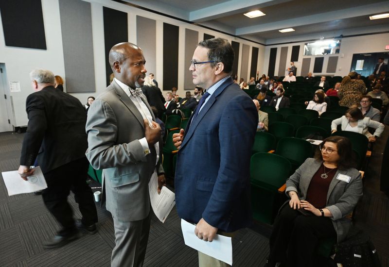 Victor S. Angry, Supervisor, Prince William County Board of Supervisors talks with David Woodward, Chair, Oakland County Board of Commissioner during the Tri-County Summit at Cranbrook Institute of Science in Bloomfield HILLS, Michigan on May 1, 2026.