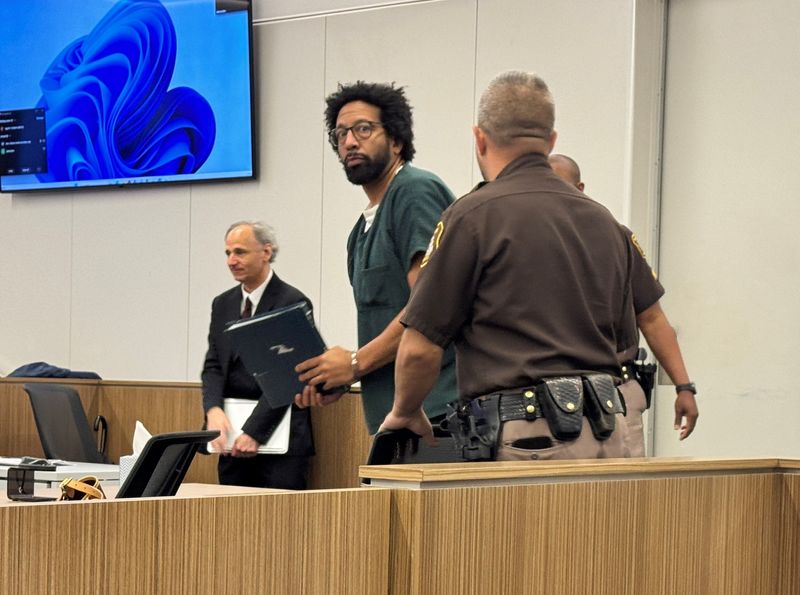 Devereaux Johnson enters the courtroom May 1.