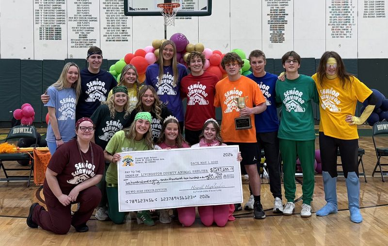 The 2026 Howell High School Senior Survivors pose for a photo with a check for the Livingston County Animal Shelter.