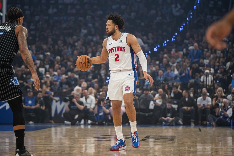 Detroit Pistons guard Cade Cunningham (2) dribbles the ball against Orlando Magic forward Paolo Banchero (5) in the first quarter of Game 6 of the first round of the 2026 NBA playoffs at Kia Center in Orlando, Florida, on Friday, May 1, 2026.