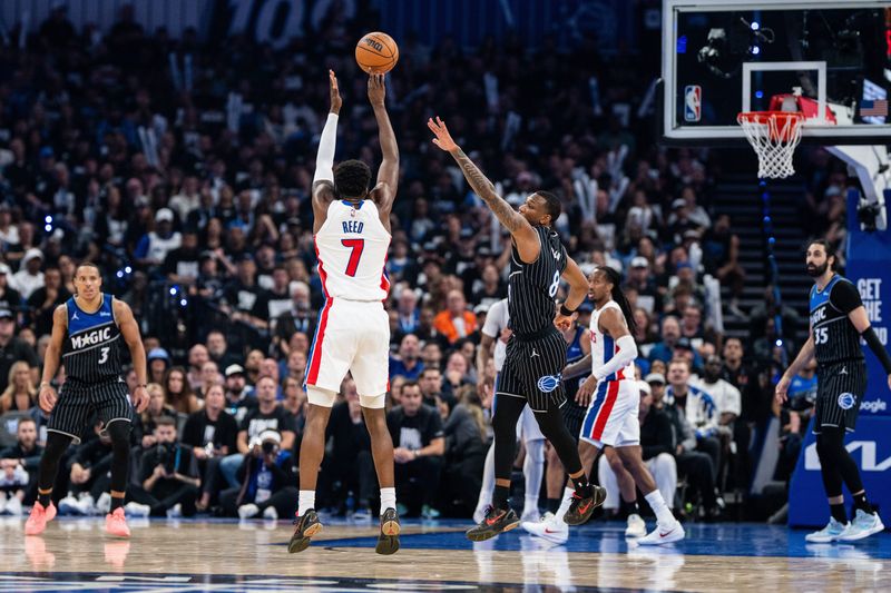 May 1, 2026; Orlando, Florida, USA; Detroit Pistons forward Paul Reed (7) shoots the ball against Orlando Magic forward Jamal Cain (8) in the fourth quarter during game six of the first round of the 2026 NBA Playoffs at Kia Center. Mandatory Credit: Jeremy Reper-Imagn Images