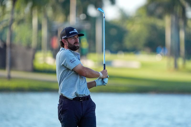 Cameron Young watches his approach shot to the 18th hole during the second round of the Cadillac Championship golf tournament.