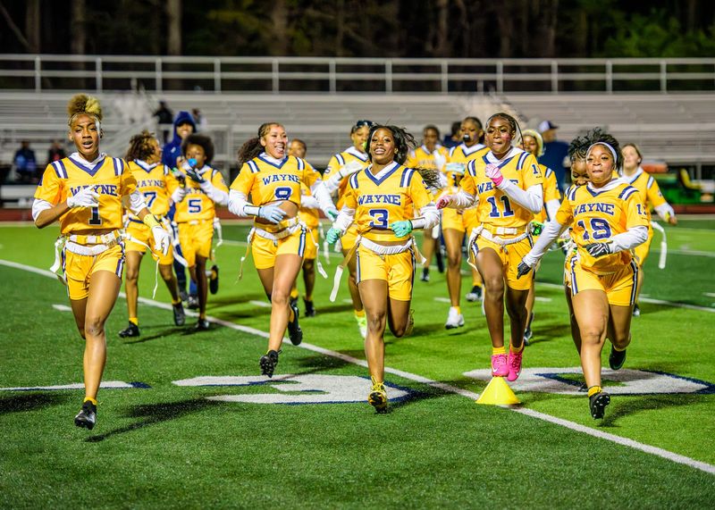 Wayne Memorial celebrates winning a Michigan Girls High School Flag Football League game on Friday, May 1, 2026.