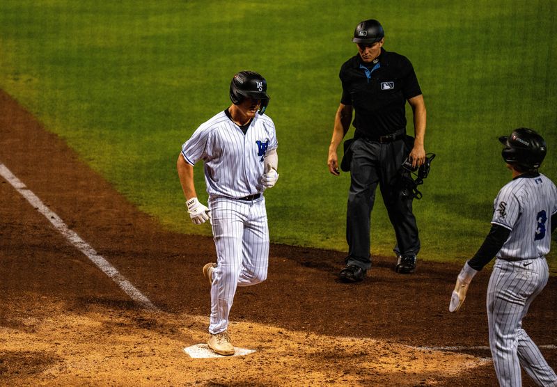 Caleb Bonemer crosses home plate in a game for the Winston-Salem Dash.