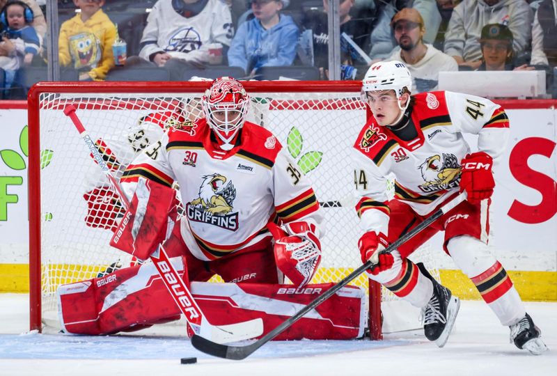 Griffins goaltender Michal Postava, left, stopped 86 of 91 shots in the playoff series against the Manitoba Moose.