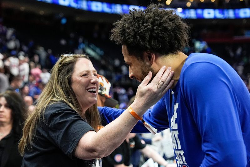 Detroit Pistons guard Cade Cunningham (2) hugs his mother Carrie Cunningham after Detroit Pistons 116-94 win over Orlando Magic to win Game 7 of first round of NBA playoffs at Little Caesars Arena in Detroit on Sunday, May 3, 2026.