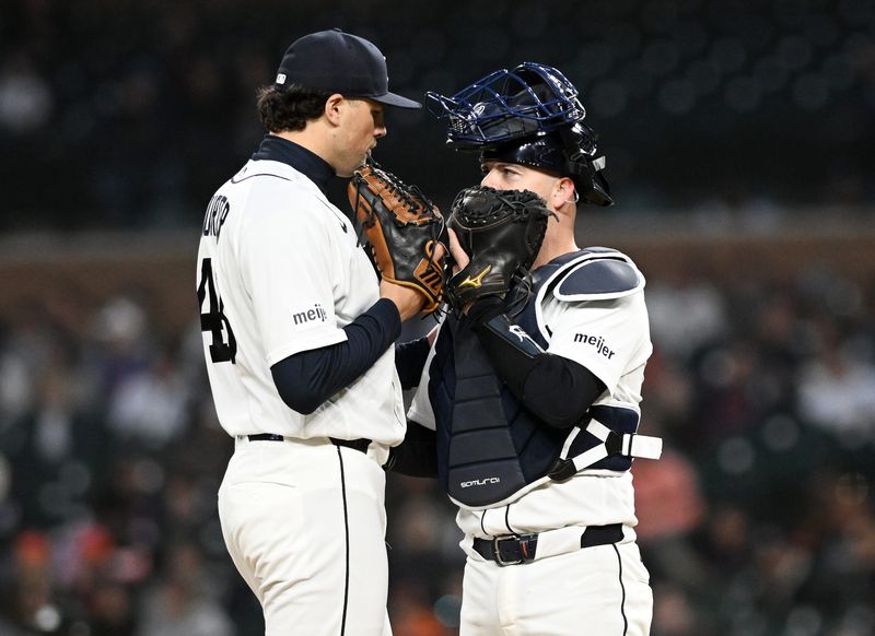 Tigers pitcher Brant Hurter (48) talks with catcher Jake Rogers in the fifth inning.