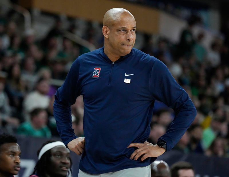 Detroit Mercy Titans head coach Mark Montgomery walks up the sidelines Tuesday, March 10, 2026, at Corteva Coliseum at the Indiana State Fairgrounds in Indianapolis during the Horizon League championship game.