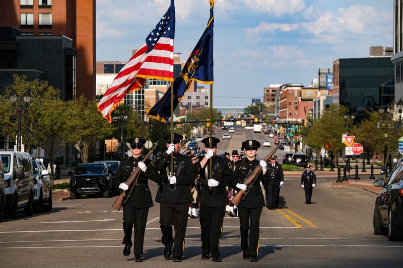 A Police Color Guard marches to the State Capitol as the 32nd Annual State of Michigan Candlelight Memorial Service begins Monday, May 4, 2026.