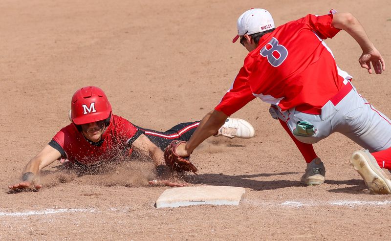 Dalen Cosby of Monroe is barely tagged out at third by Jason Bryant of Bedford during a 7-6 Bedford victory on Monday, May 4, 2026.