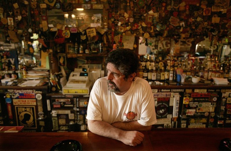 Dan Overstreet, owner of the Old Miami on Cass Avenue in Detroit, stands behind the bar Tuesday, Feb. 10, 2003.