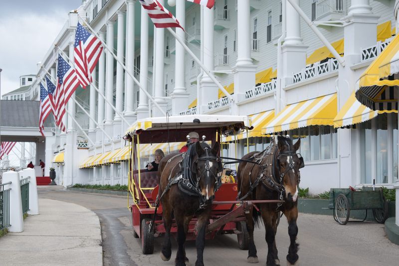 Horse-drawn taxi leaves Grand Hotel on Mackinac Island on Friday, May 1, 2026.